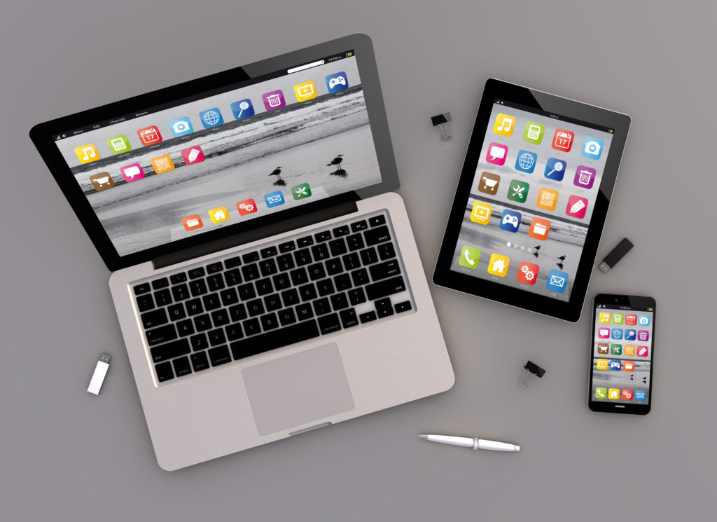 3d render of devices with laptop computer, tablet pc and touchscreen smartphone. top view. all screen graphics are made up.