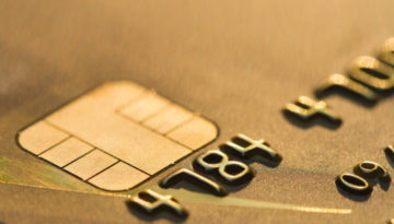 Close up of a credit card, picturing the chip and first 6 numbers of the card