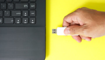 usb flash drive memory stick on yellow background