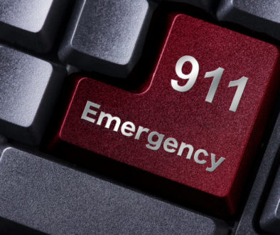 keyboard enter button labeled 911 emergency